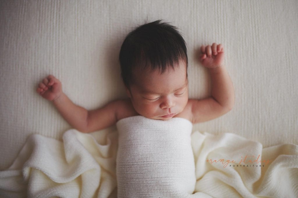 7 days old relaxed baby girl newborn portraits in singapore studio