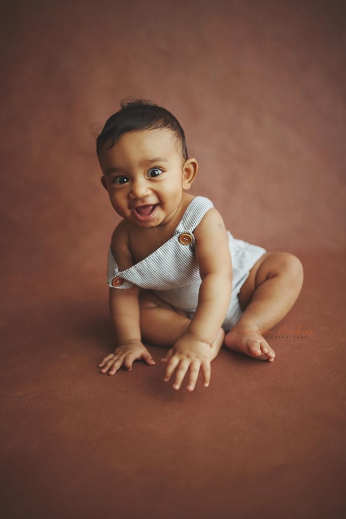 smiling 6 months old baby portraits in singapore natural light studio