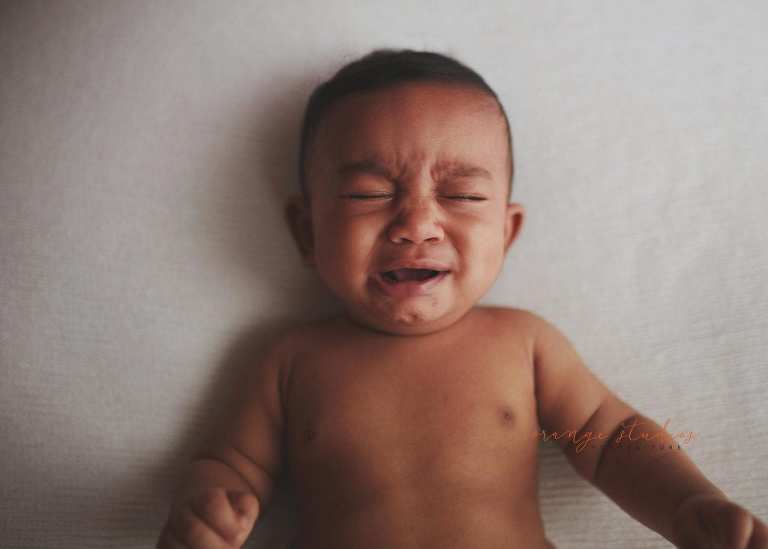 crying 6 months old baby portraits in singapore natural light studio