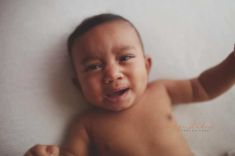 crying 6 months old baby portraits in singapore natural light studio