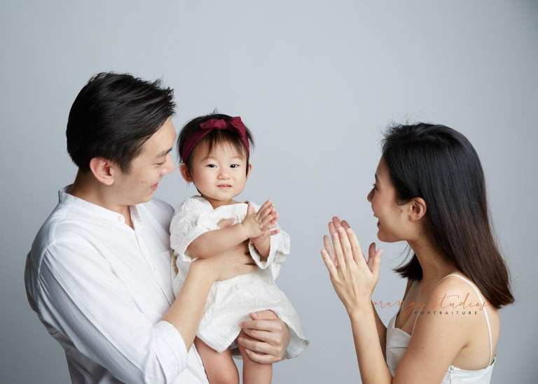 1 year old baby girl with parents family portraits in singapore studio
