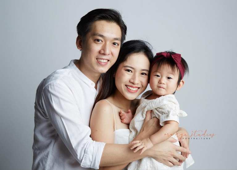 1 year old baby girl with parents family portraits in singapore studio