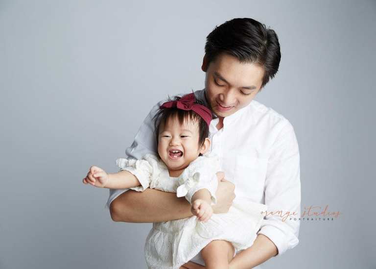 1 year old baby girl with dad family portraits in singapore studio