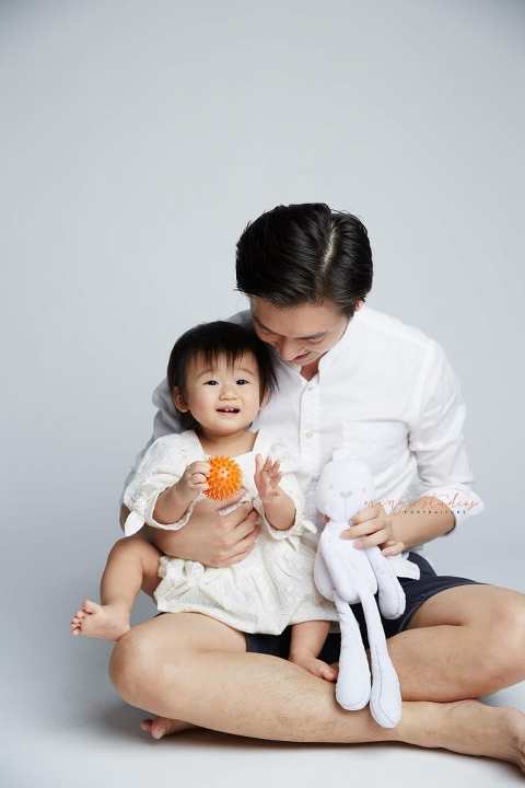 1 year old baby girl with dad family portraits in singapore studio