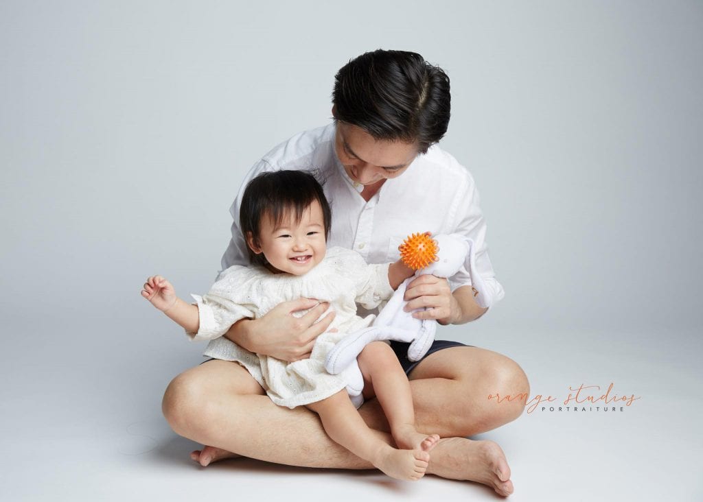 1 year old baby girl with dad family portraits in singapore studio