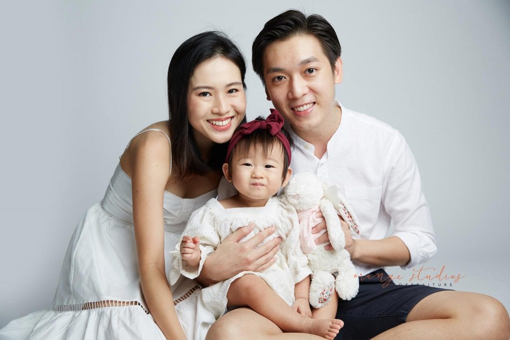 1 year old baby girl with parents family portraits in singapore studio