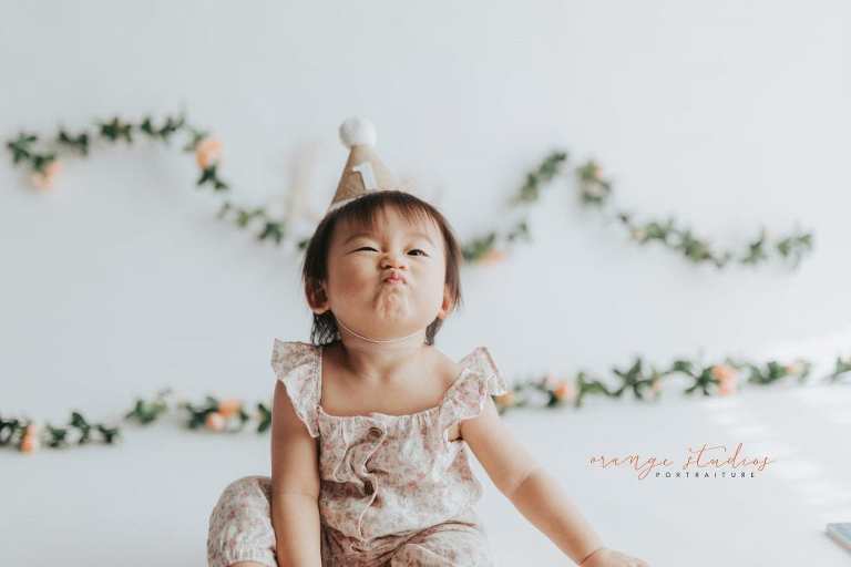 adorable 1 year old baby girl floral theme cake smash in singapore studio
