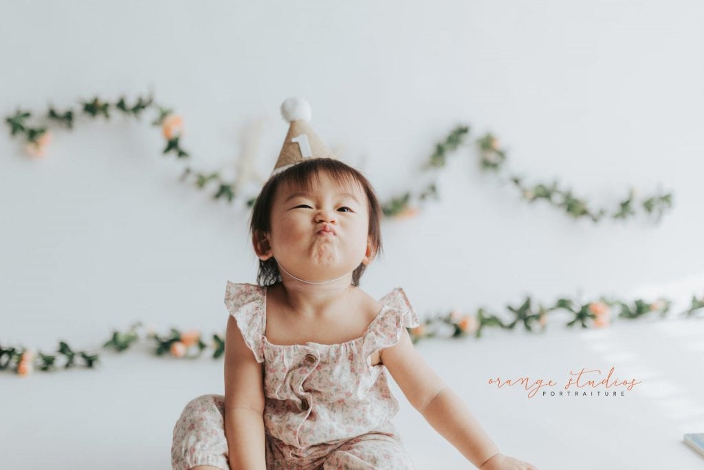 adorable 1 year old baby girl floral theme cake smash in singapore studio