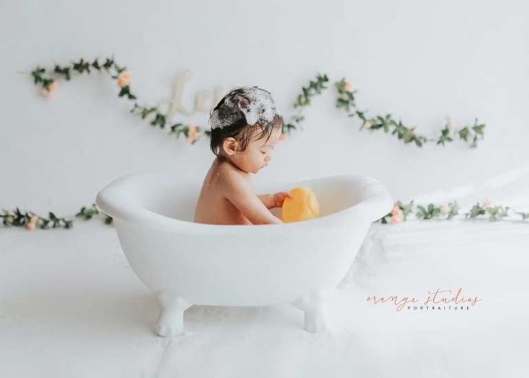 1 year old baby girl bubble bath portraits in singapore studio natural light