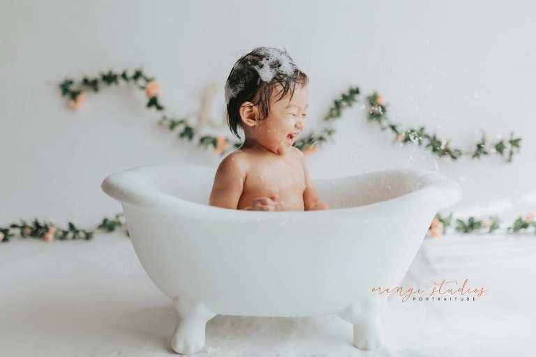 1 year old baby girl bubble bath portraits in singapore studio natural light
