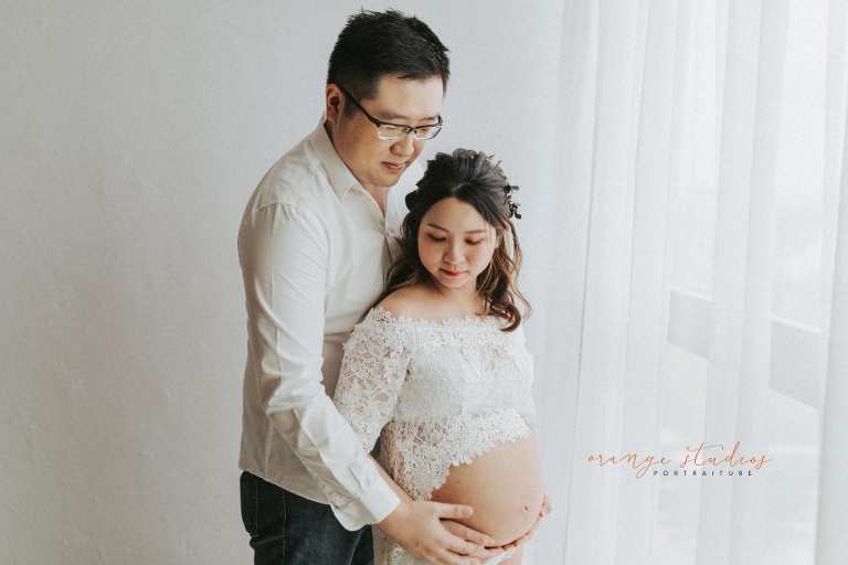 maternity portraits with husband in singapore studio natural light