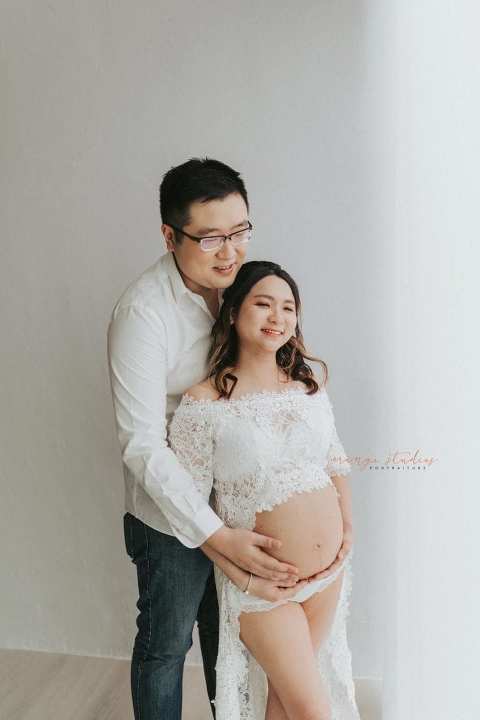 maternity portraits with husband in singapore studio natural light
