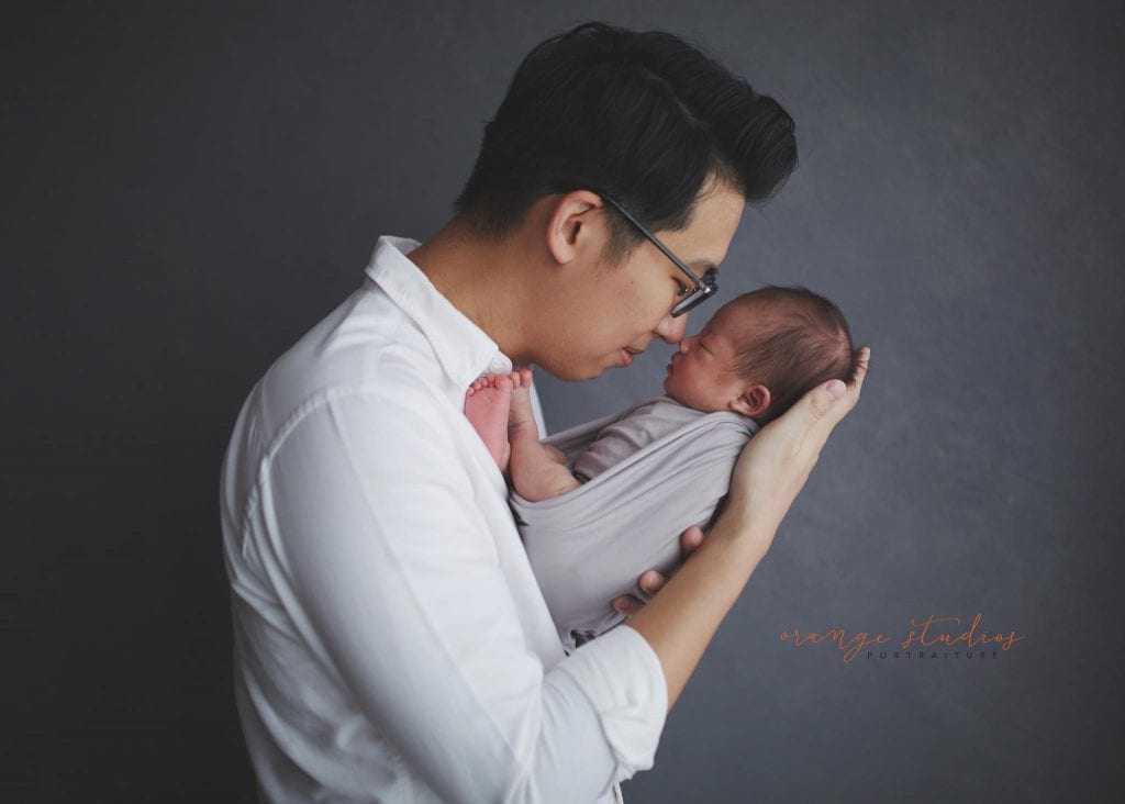 14 days old baby boy with dad newborn portraits in singapore studio