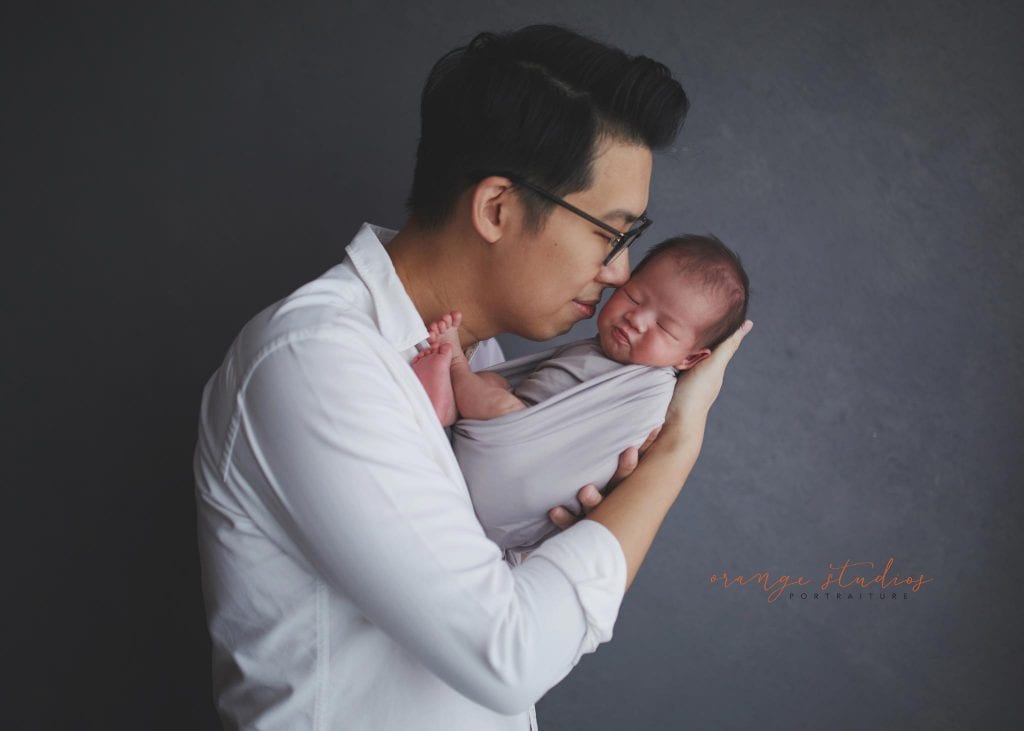 14 days old baby boy with dad newborn portraits in singapore studio