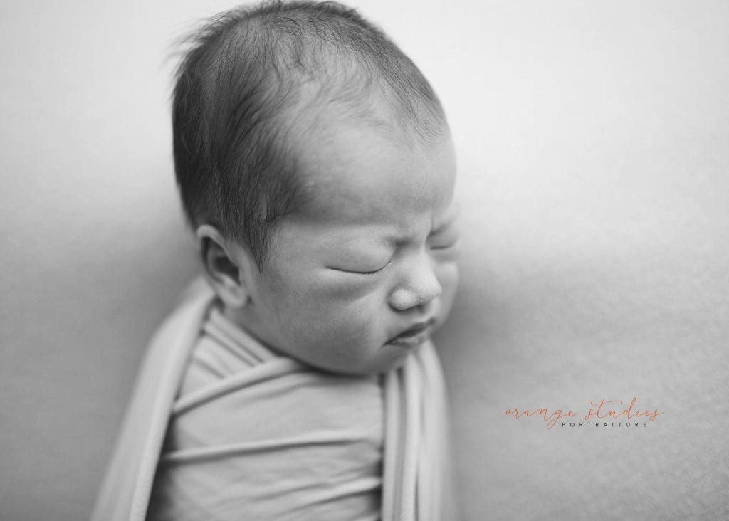 14 days old baby boy black and whiten ewborn portraits in singapore studio natural light