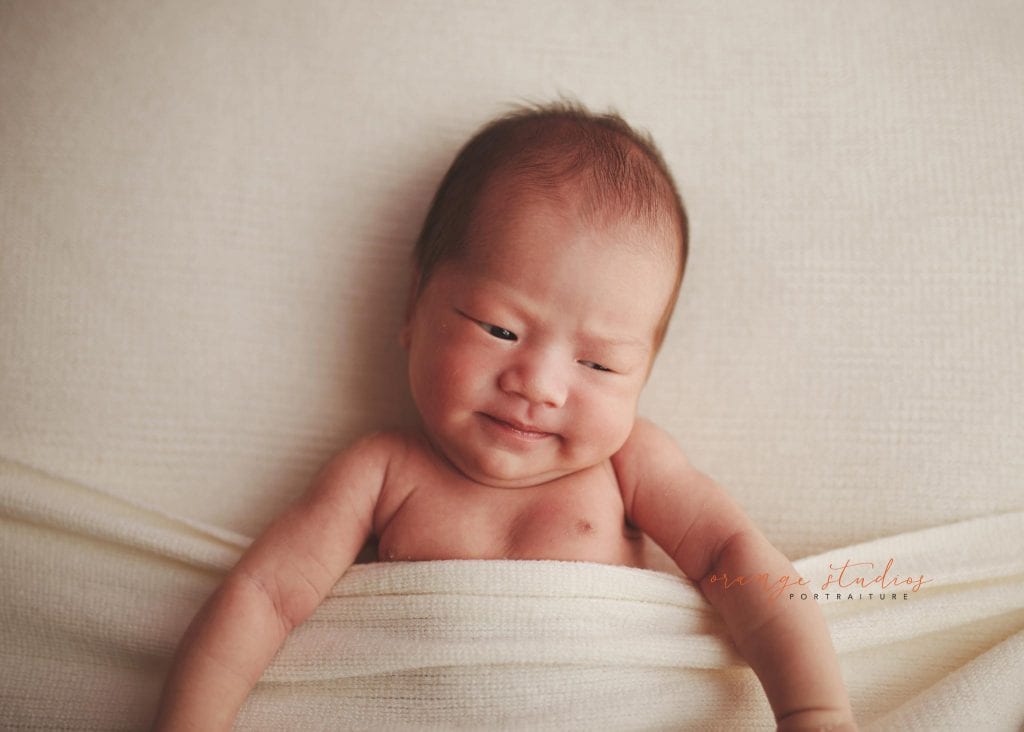 awake 14 days old baby boy newborn portraits in singapore studio natural light