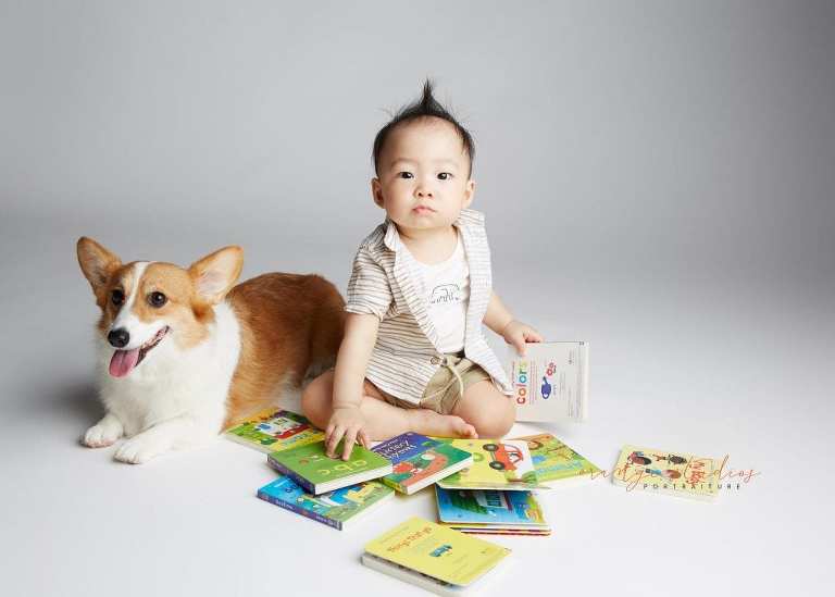 1 year old baby boy with pet dog siblings portraits in singapore studio