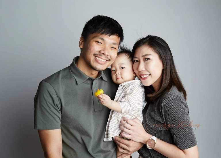 1 year old baby boy with parents family portraits in singapore studio