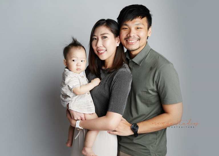 1 year old baby boy with parents family portraits in singapore studio