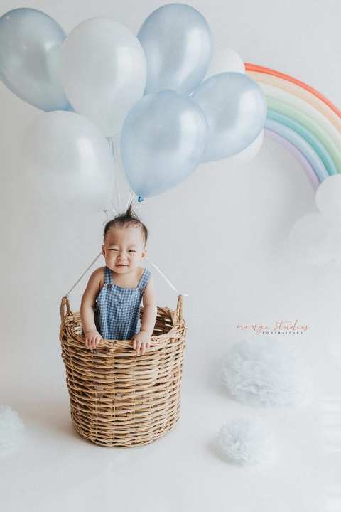 1 year old baby boy in hot air balloon portraits in singapore natural light studio