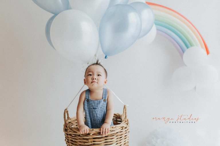 1 year old baby boy in hot air balloon portraits in singapore natural light studio