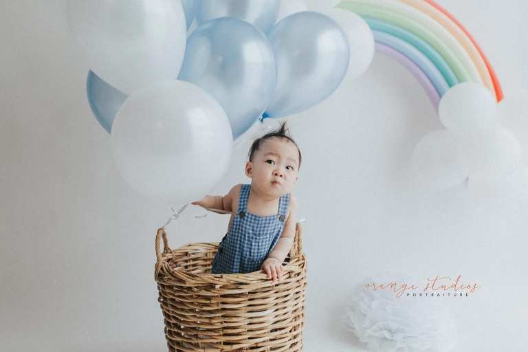 1 year old baby boy in hot air balloon portraits in singapore natural light studio