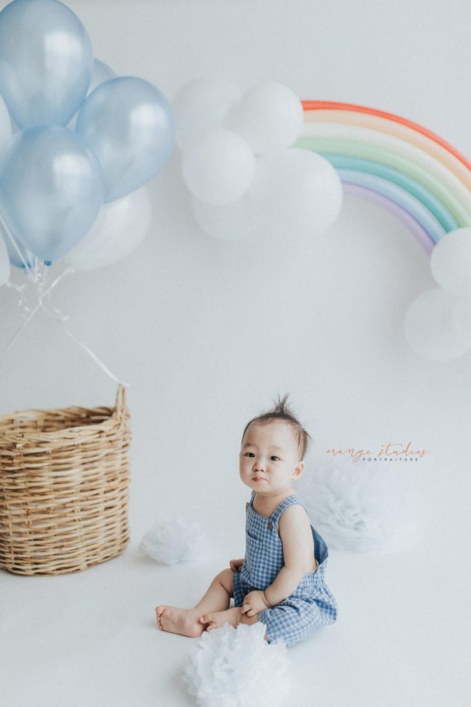 1 year old baby boy rainbow hot air balloon theme portraits in singapore natural light studio