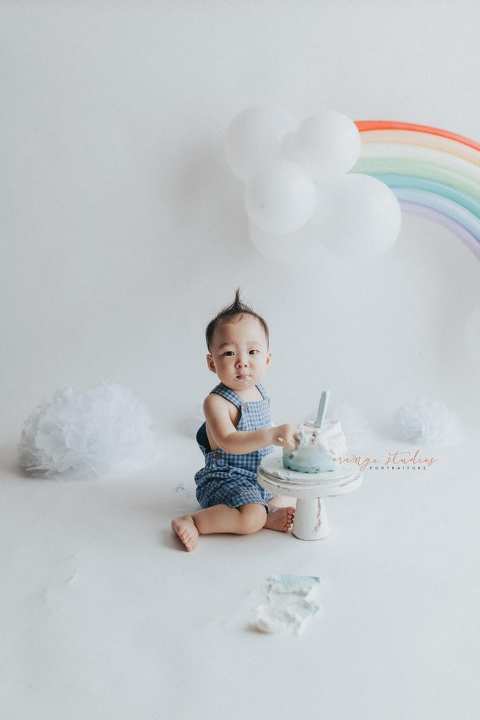 1 year old baby boy rainbow theme cake smash portraits in singapore natural light studio