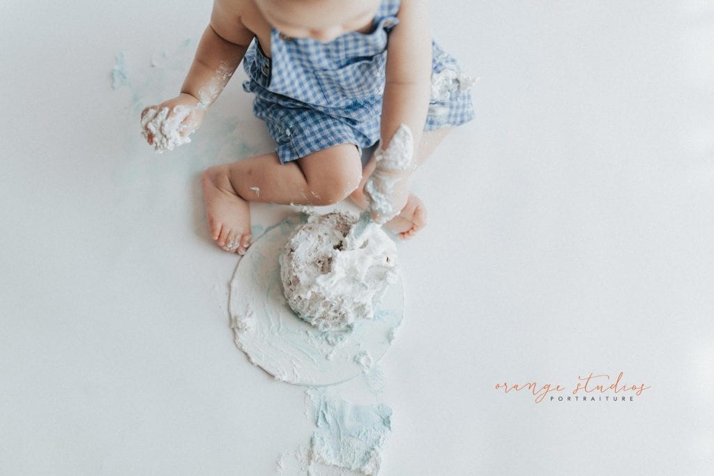 1 year old baby boy rainbow theme cake smash portraits in singapore natural light studio