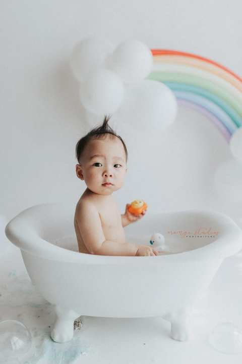 1 year old baby boy rainbow theme bubble bath portraits in singapore natural light studio