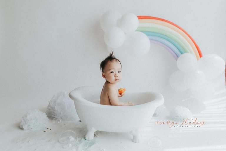 1 year old baby boy rainbow theme bubble bath portraits in singapore natural light studio