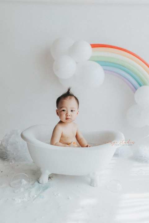 1 year old baby boy rainbow theme bubble bath portraits in singapore natural light studio