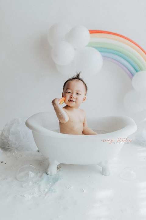 1 year old baby boy rainbow theme bubble bath portraits in singapore natural light studio