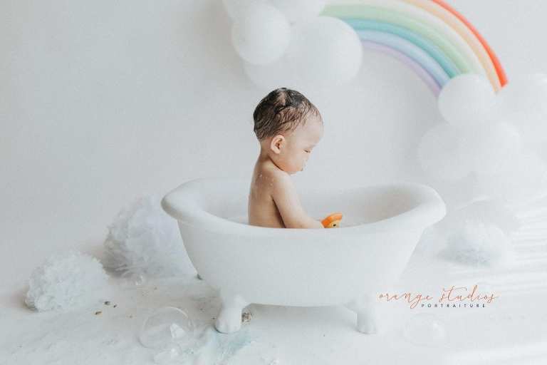1 year old baby boy rainbow theme bubble bath portraits in singapore natural light studio