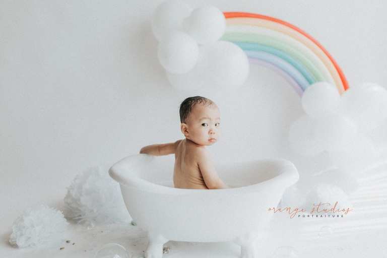 1 year old baby boy rainbow theme bubble bath portraits in singapore natural light studio