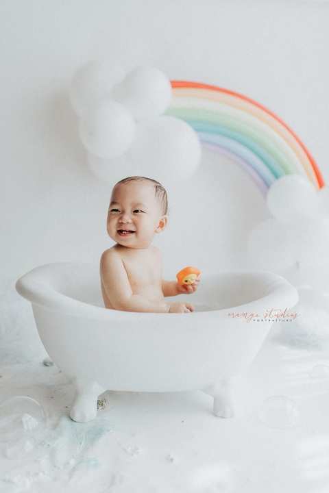 1 year old baby boy rainbow theme bubble bath portraits in singapore natural light studio