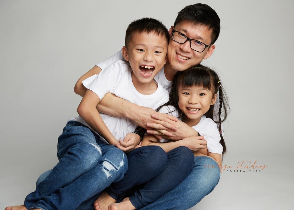dad and kids fun family portraits in singapore studio