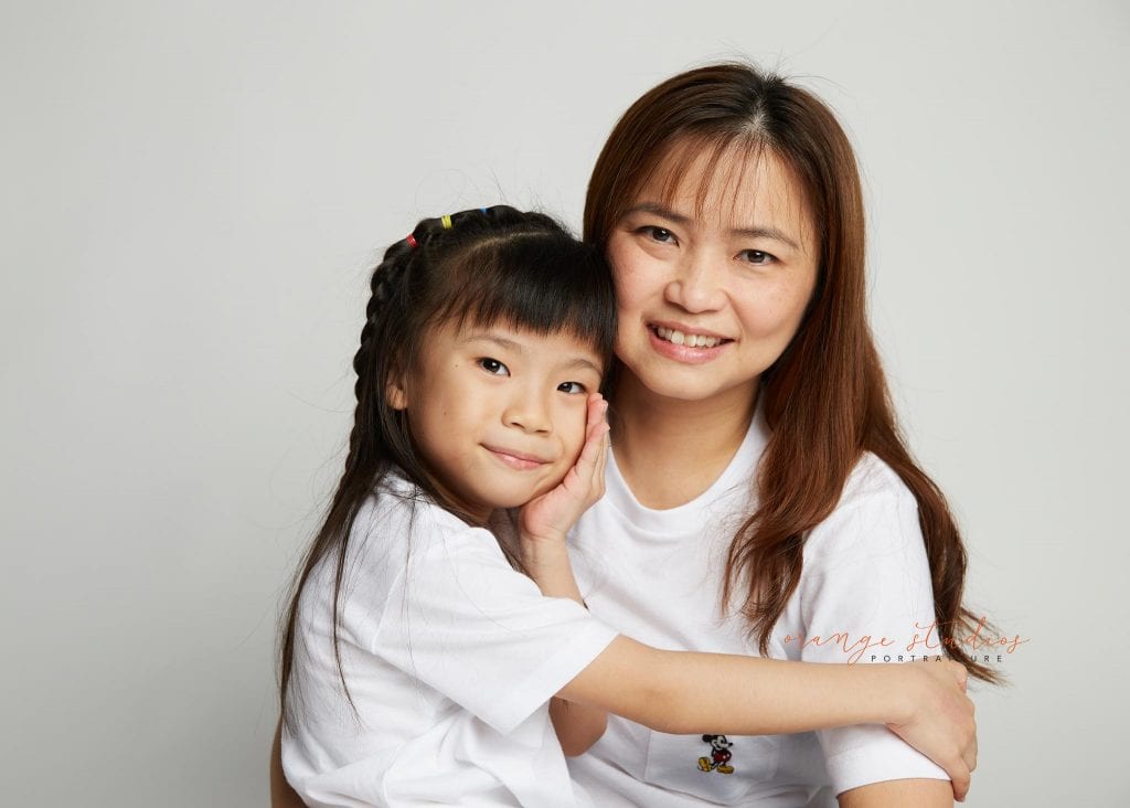 mum and daughter sweet family portraits in singapore studio