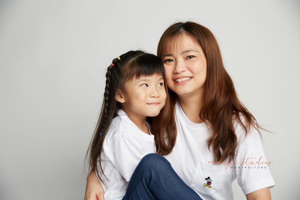 mum and daughter sweet family portraits in singapore studio