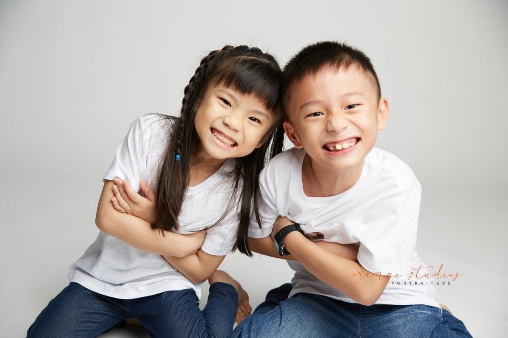 brother and sister siblings portraits in singapore studio