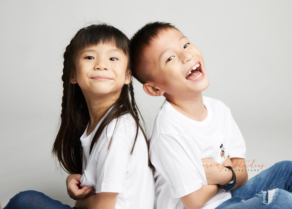 brother and sister fun siblings portraits in singapore studio