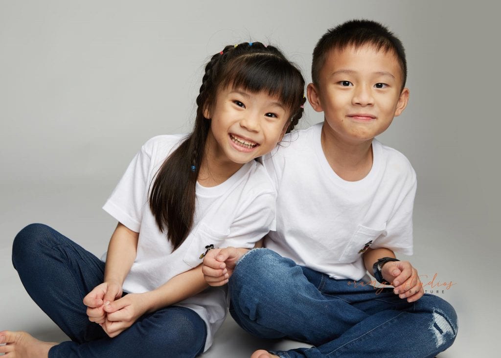 brother and sister fun siblings portraits in singapore studio