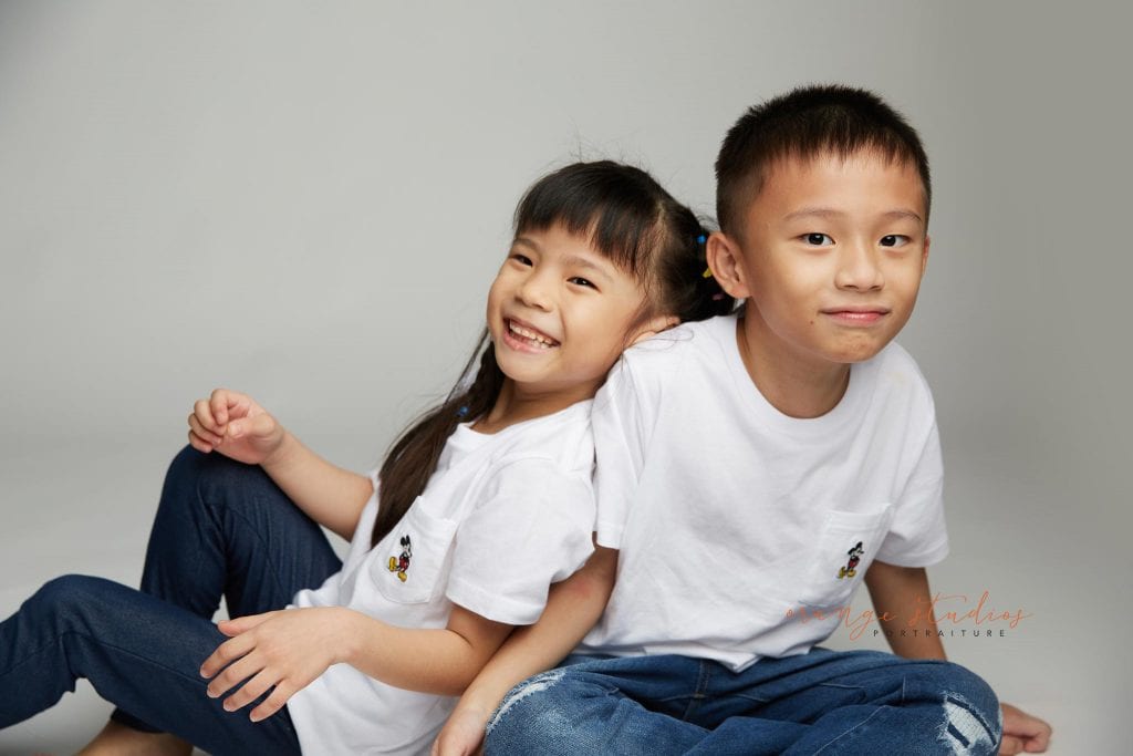 brother and sister fun siblings portraits in singapore studio