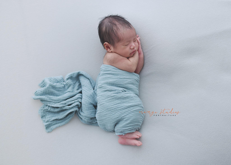 baby wrapped newborn photoshoot Singapore