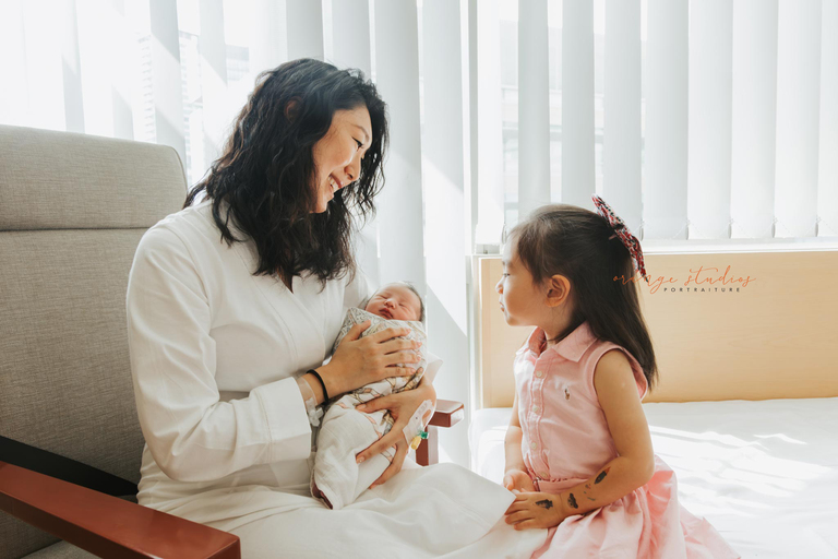 sibling meeting newborn baby hospital moment