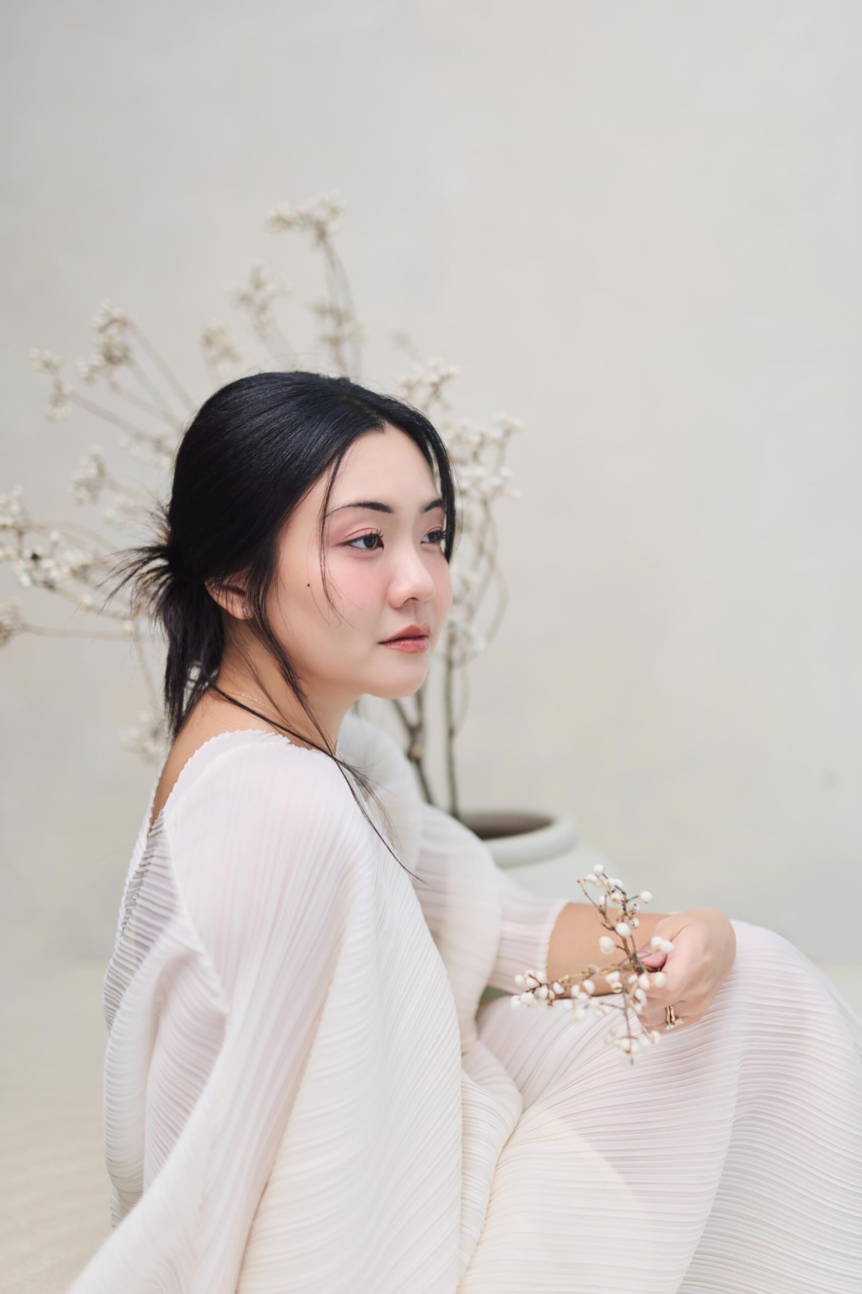 High-key New Chinese Style portrait in cream and pale celadon