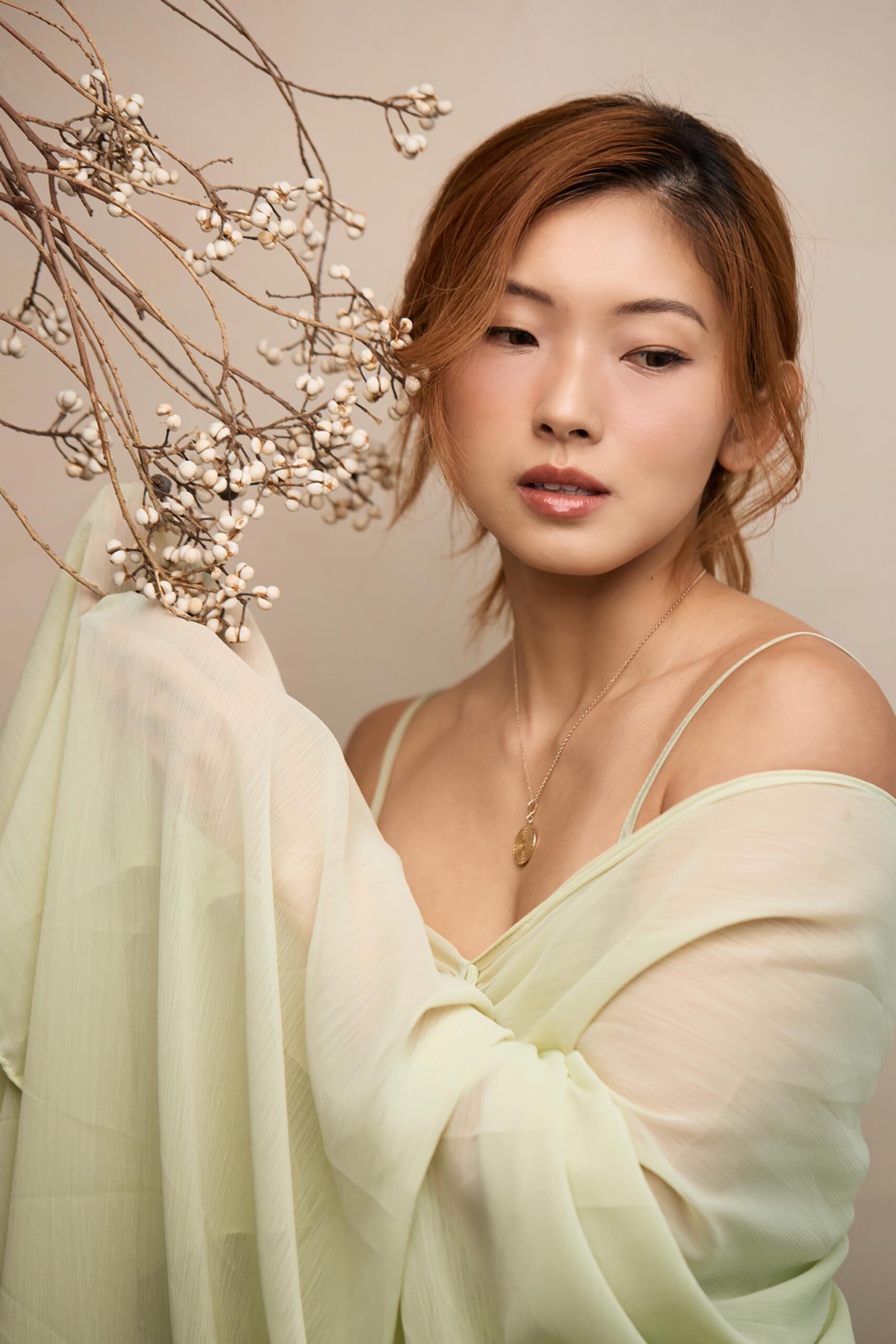 Low-key 新中式 portrait with deep ink tones and dramatic side lighting