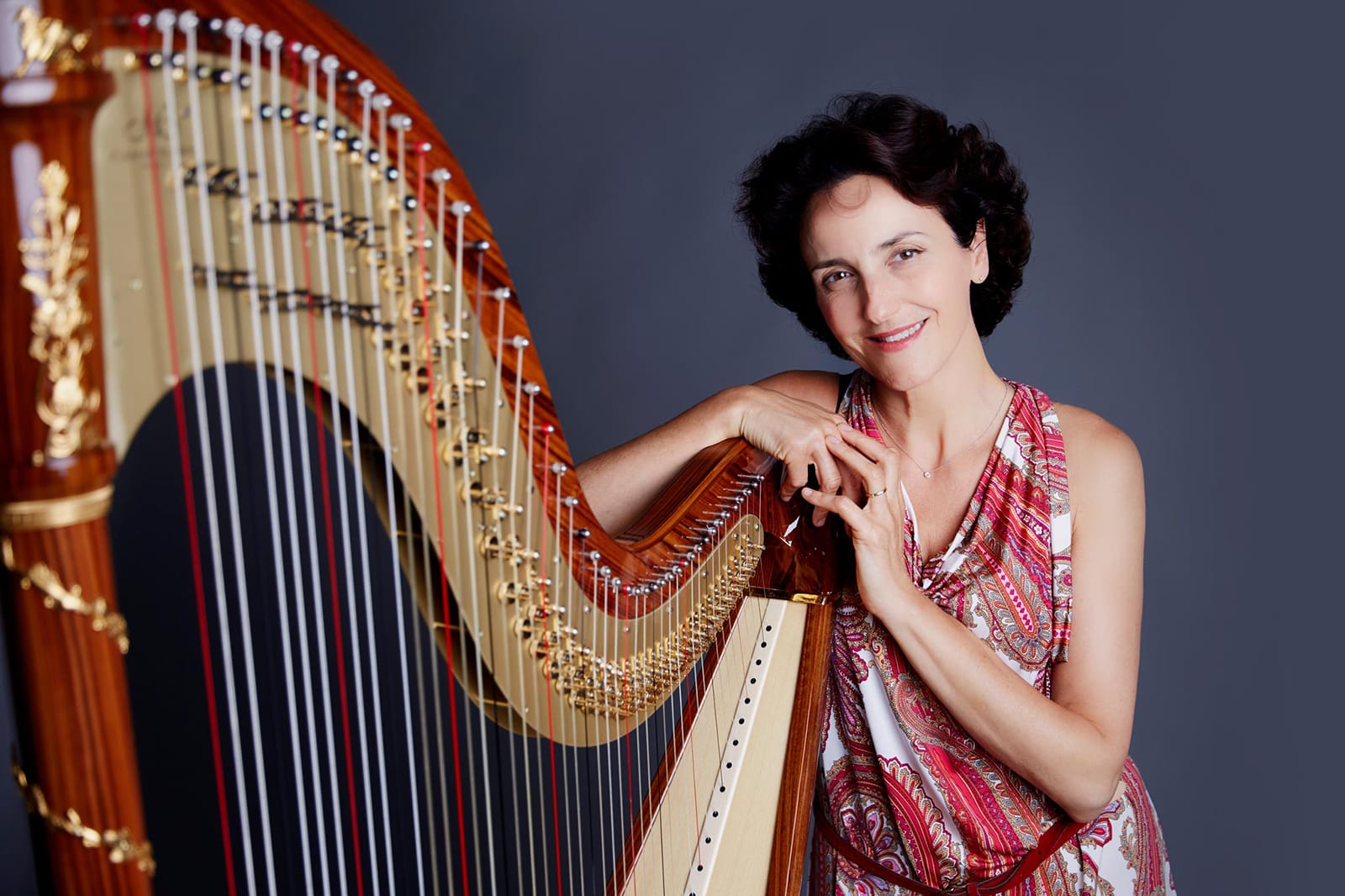 Harp student portrait with their instrument, Orange Studios Singapore